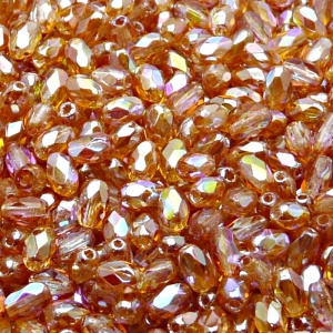 50ks České skleněné broušené tvarové ohňovky olivy 6x4mm čirá/ oranžová duha