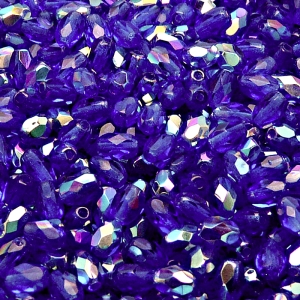 50ks České skleněné broušené tvarové ohňovky olivy 6x4mm tmavý safír/ AB polopokov